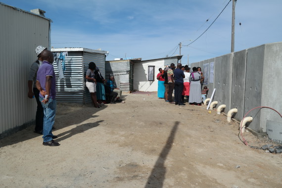 Tambo Square community use back of newly installed toilets for mapping workshop to plan further upgrading initiatives in their settlement. 