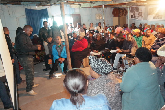 Nkokheli facilitates a community gathering with informal settlement leaders in Khayelitsha's Site B 
